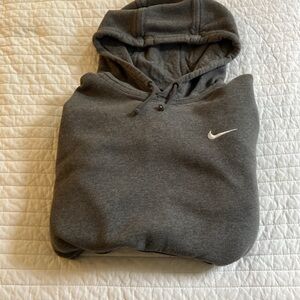 Woman’s grey Nike hoodies